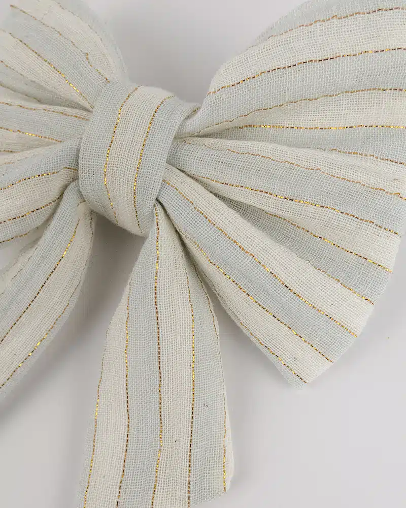 Barrette à noeud rayée et fils brillants or fait main par Atelier Araçari